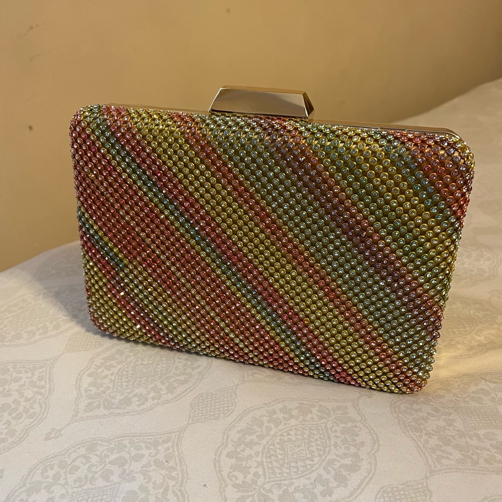 Used once Rainbow/Gold clutch